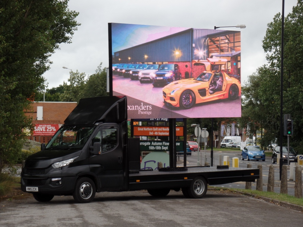Promogroup Outdoor Advertising on mobile advertising vehicles